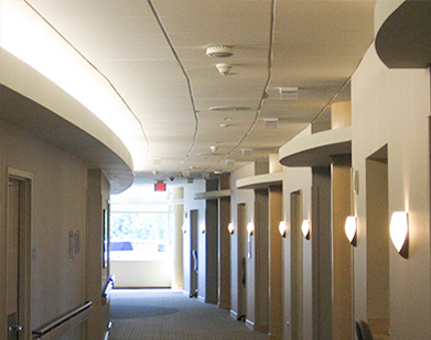 Medical Ceiling Appilication: Traditional accoustical ceiling panels in the hallway of a medical facility