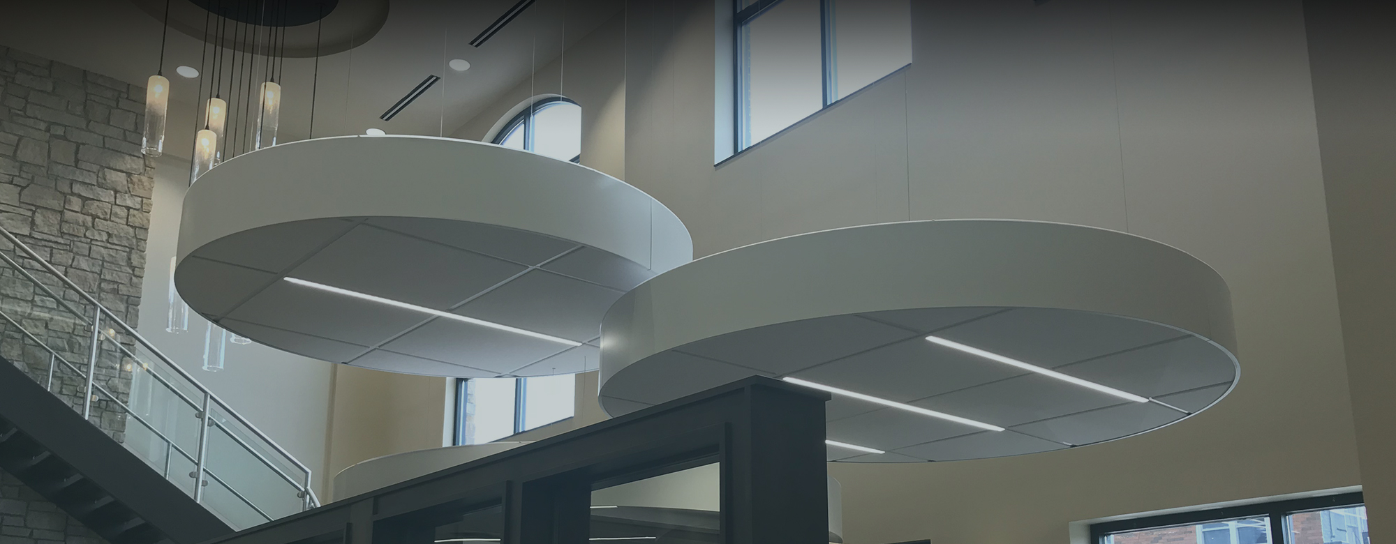 Floating cloud accoustical ceiling system in an office building