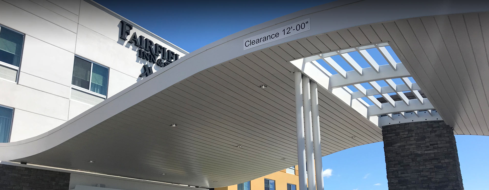 Overhead acoustical ceiling structure of the entrance awning for a medical facility
