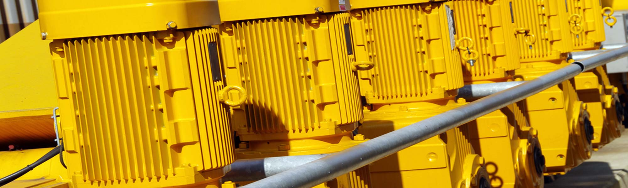 Row of yellow electric motors